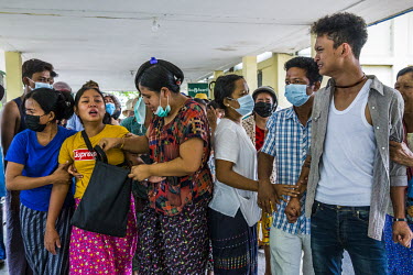 Family and friends mourn at the funeral of a protestor Ko Aung Ko Oo (29), who was shot and killed when the security forces fired on protestors and civilians as they raided into South Dagon township t...