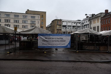 A banner indicts that the city's market in the city centre is closed as a result of the United Kingdom's third lockdown as a variant of COVID-19 is causing increases in numbers of cases of coronavirus...