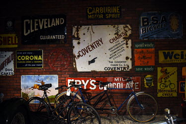 Original advertisements for products including cycles and motor accessories are displayed in the Coventry Transport Museum, on its first day of reopening since the UK's coronavirus lockdown, on 20th J...