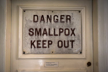 An original sign warning people of a danger of smallpox is displayed on a door at Dr Jenner's House Museum. The museum where Dr Edward Jenner lived and worked is dedicated to the pioneer of the smallp...