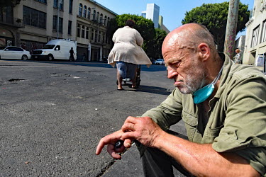 Scotty, a homeless crystal meth addict sits on the pavement on San Pedro street.  Thousands of homeless people camp out in the centre of Los Angeles, in an area of about 50 blocks. In greater Los Ange...