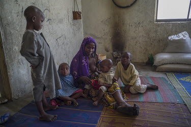 Maimuna Abdullahi with her children. 'My son was killed in fighting, killed by the insurgents when they attacked our village. We fled to Cameroon and were there for more than a year. Now we are here i...