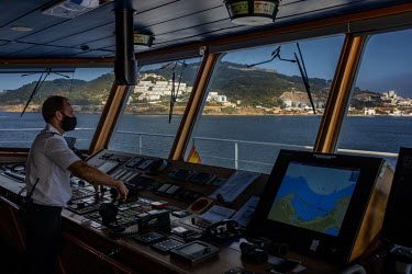 The captain on the bridge of the ferry from Algeciras, on the Spanish mainland, as it arrives in Ceuta.