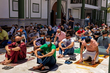 People taking part in Friday prayers in the courtyard of the Sidi Benbarek Mosque.