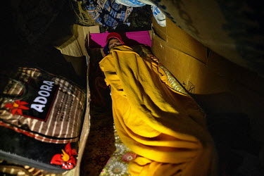 A migrant sleeps in a makeshift shelter beside Benitez Beach in the Spanish exclave of Ceuta.