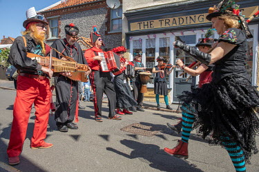 Morris dancers performing during the annual Sheringham Potty Morris festival.  Sheringham is a Victorian-era English seaside resort that was popular up through the 1950s before mass travel to other pa...