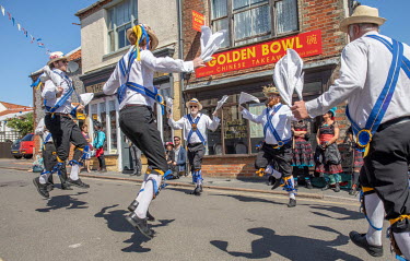 Morris dancers performing during the annual Sheringham Potty Morris festival.  Sheringham is a Victorian-era English seaside resort that was popular up through the 1950s before mass travel to other pa...
