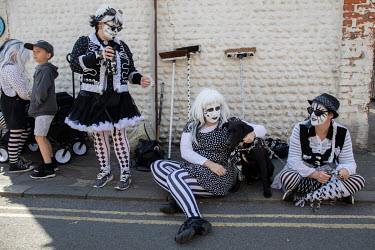 A group of Morris dancers, performing during the annual Sheringham Potty Morris festival, take a break from their dancing.  Sheringham is a Victorian-era English seaside resort that was popular up thr...
