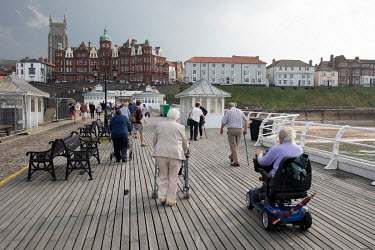 People on the town's Victorian pier, housing the UK's only remaining end of the pier theatre and variety show. In the background is the Hotel de Paris, a famous Victorian hotel whose guests have inclu...
