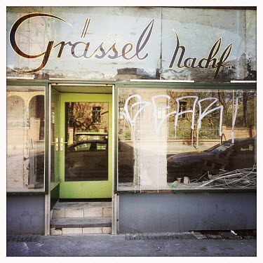 The facade of Graessel Nachfolger, a closed-down shop in Moabit.  The Berlin district of Moabit is an artificial island completely surrounded by water that was once home to various industries and stau...