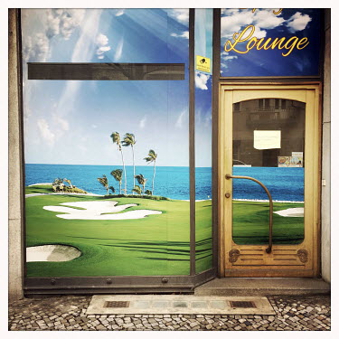 The facade of a closed golf shop.  The Berlin district of Moabit is an artificial island completely surrounded by water that was once home to various industries and staunchly working-class . However,...