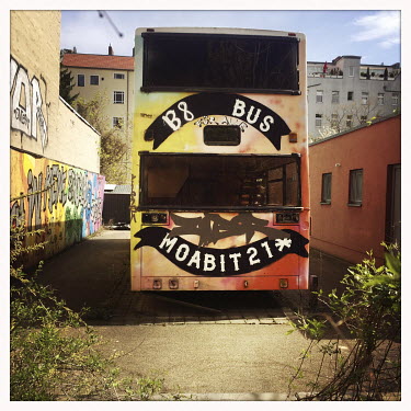 'Moabit 21', graffiti on a bus in Moabit.  The Berlin district of Moabit is an artificial island completely surrounded by water that was once home to various industries and staunchly working-class . H...