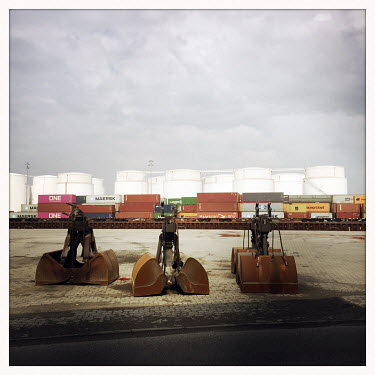 Shipping containers and machinery inside the Behala Westhafen industrial and harbour area.  The Berlin district of Moabit is an artificial island completely surrounded by water that was once home to v...