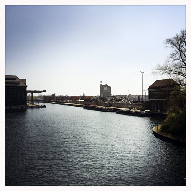 A waterway in the Behala Westhafen industrial and harbour district.  The Berlin district of Moabit is an artificial island completely surrounded by water that was once home to various industries and...