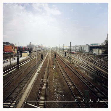 Railway tracks in Moabit.  The Berlin district of Moabit is an artificial island completely surrounded by water that was once home to various industries and staunchly working-class . However, with gen...