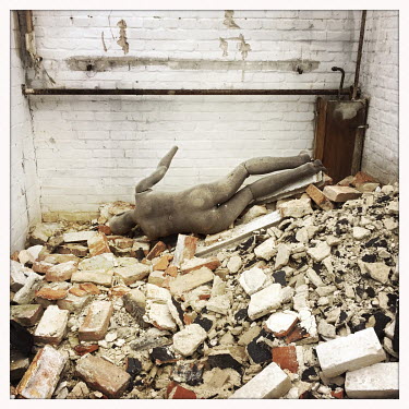 A mannequin lies among rubble in a derelict brick garage on the Turmstrasse.  The Berlin district of Moabit is an artificial island completely surrounded by water that was once home to various industr...