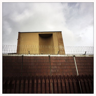 Facade of the Moabit prison.  The Berlin district of Moabit is an artificial island completely surrounded by water that was once home to various industries and staunchly working-class . However, with...