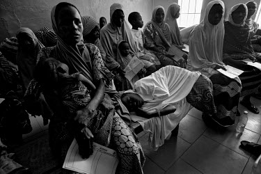 Patients wait in a clinic in an IDP camp. Many new arrivals to the camps are malnourished.