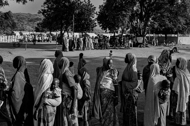 Mothers queue to get supplies such as baby milk powder in Gwoza, once declared the capital of the caliphate by Boko Haram but now back under the control of the Nigerian armed forces. Â�