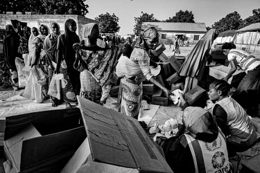 Mothers queuing for cereal supplies in Gwoza IDP camp. Gwoza town was captured by Boko Haram in 2014 with the Nigerian armed forces reclaiming the town a year later.