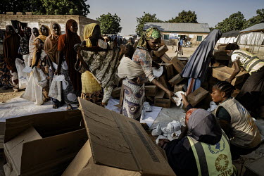 Mothers queuing for cereal supplies in Gwoza IDP camp. Gwoza town was captured by Boko Haram in 2014 with the Nigerian armed forces reclaiming the town a year later.