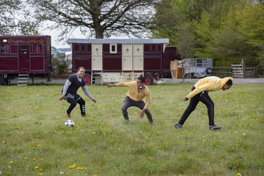 Members of The New Revolution Troupe from Havana, Cuba play a game of football outside their caravans where they quarantined on arrival in Gloucestershire'  Giffords Circus rehearse for 'The Hooley',...