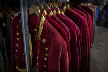 The iconic Giffords front of house costumes hanging in the wardrobe department.   Giffords Circus have been rehearsing for 'The Hooley', their 2021 show, postponed from 2020 due to the COVID-19 pandem...