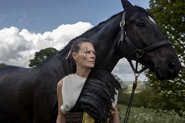 Equestrienne, Lotte Seal, with one of the Giffords Circus horses, looks towards the valley below Giffords' HQ at Fennells Farm near Stroud.   Giffords Circus have been rehearsing for 'The Hooley', the...