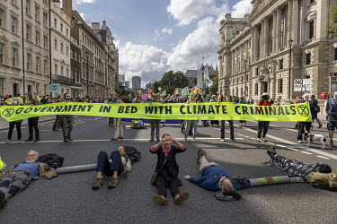 Extinction Rebellion (XR) activists lie down to occupy and block Whitehall.