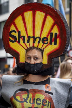 An Extinction Rebellion activist protests big oil company Shell during a march and occupation in London's West End.