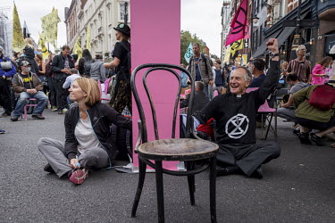 Extinction Rebellion activists locked on to a structure in St Martin's Lane, part of an occupation protest in London's West End.