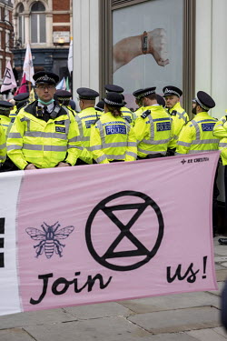 Police on duty during an Extinction Rebellion march and occupation in London's West End.