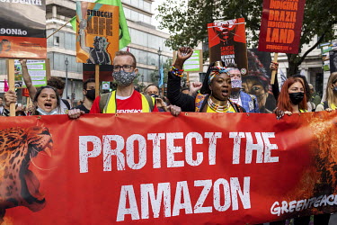 Activists gather behind a banner for the 'Amazon Rebellion' outside the Brazilian Embassy. The protest was joined by various NGOs and activist groups including by by Brazil Matters, CAFOD, Extinction...