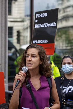 An 'Amazon Rebellion' activist talks to the crowd during protests against Bill PL490, legislation planned by the Brazilian Bolsonaro regime, outside the Brazilian Embassy. The protest was joined by va...