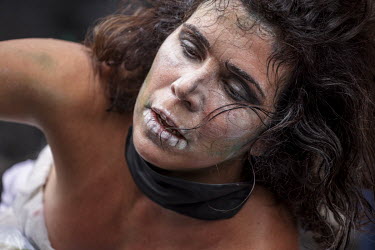 An activist performing during the 'Amazon Rebellion' outside the Brazilian Embassy. The protest was joined by various NGOs and activist groups including by by Brazil Matters, CAFOD, Extinction Rebelli...