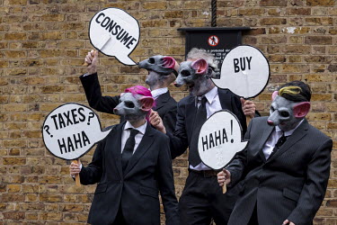 Extinction Rebellion activists the 'Corp Rats' during the 'Stop the Harm' march from Hyde Park to the Department for Business, Energy and Industrial Strategy.