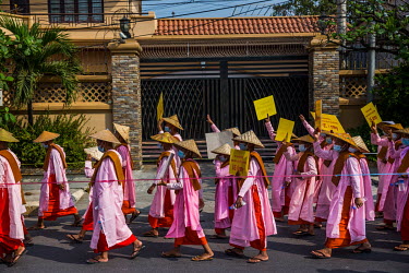 Buddhist nuns march to protest against the military coup in Mandalay. On 2 February 2021 the Maynmar military, known as the Tatmadaw, seized power from the civilian government of Aung San Suu Kyi.