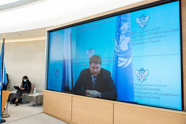 A Russian delegate speaking remotely on screen, addressing the opening session of the UN Human Rights Council deliberations in Geneva. Due to Covid restrictions the meeting is mainly taking place onli...