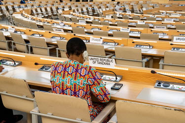 A diplomat representing Tanzania in the empty hall at the opening session of the UN Human Rights Council deliberations in Geneva. Due to Covid restrictions the meeting is mainly taking place online.