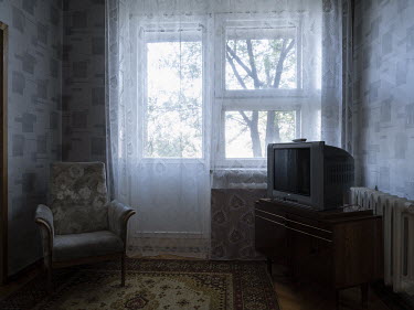 An armchair and televionsion in a room in the Soviet era Mayak Hotel in Kurchatov. From 1949 until 1991 the Soviet government conducted 456 nuclear tests at the Semipalatinsk Test Site, also known as...