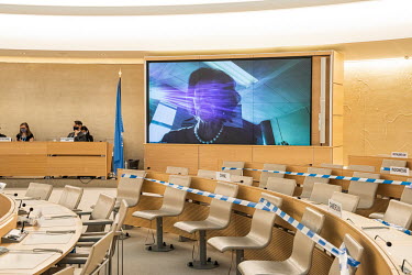 An Austrian delegate, representing the EU, speaking remotely on screen, addresses the opening session of the UN Human Rights Council deliberations in Geneva. Due to Covid-19 the council is meeting in...