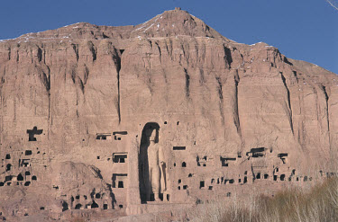 The 'small Buddha' (eastern Buddha - 6th to 7th century CE) surrounded by caves inhabited by displaced people. The Buddhas were destroyed by the Taliban in 2001.