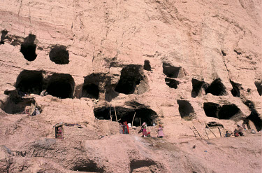 Caves inhabited by Hazara refugees from Kabul and other parts of Afghanistan who were fleeing Taliban forces. The caves sit next to the two Buddhas of Bamiyan. The Buddhas were destroyed by the Taliba...