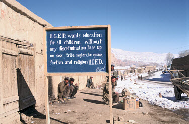 A sign on the main street of Bamiyan calls for education for children regardless of sex, tribe, region, language, faction or religion.
