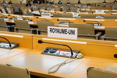 Opening session of the UN Human Human Rights Council with the UK seat empty, in the foreground. Due to Covid restrictions the meeting is mainly taking place online. As with a number of UN conferences...