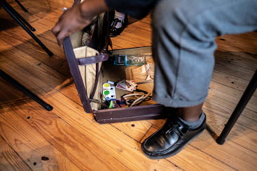 Equipment for magic tricks inside a student's briefcase at the Cape Town College of Magic.