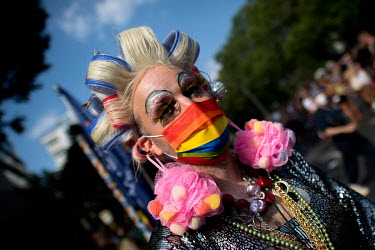 Drag Queen with costume and face mask in Rainbow colours at the Berlin's annual Christopher Street Day CSD Pride parade in Berlin.