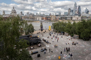 Front courtyard of the Tate Modern Museum with the River Thames, Millennium Footbridge and the City of London in the background. As part of the Please Draw Freely collaborative art project inside the...