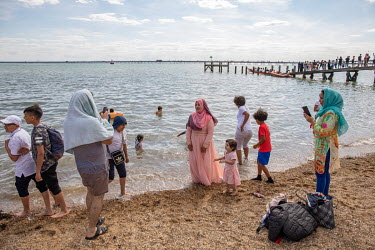 A Muslim family on the beach at Southend-on-Sea, a popular destination for people from London and Essex.