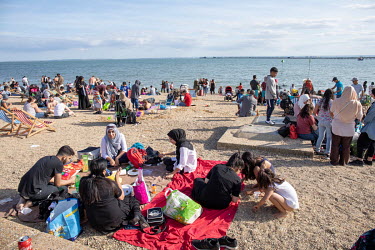 People enjoy a sunny day on the beach at Southend-on-Sea, a popular destination for people from London and Essex.
